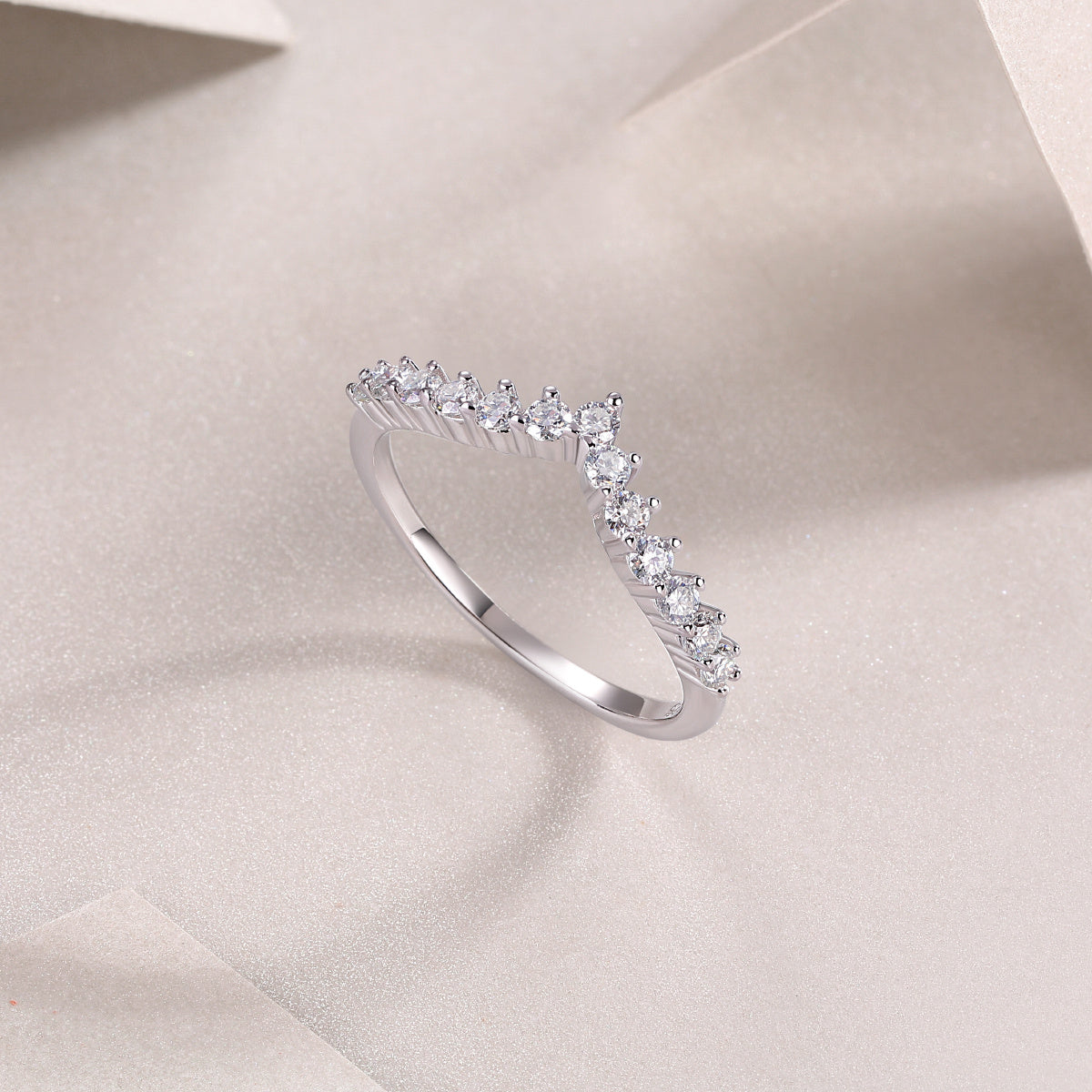 Crown moissanite band stacked with engagement ring
